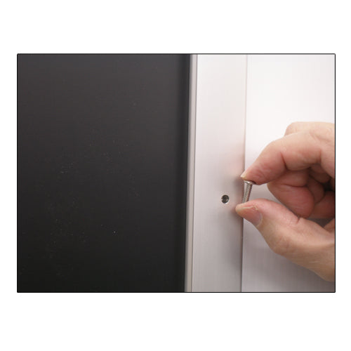 REMOVE SECURITY SCREWS FROM THE 30 x 40 FRAME PROFILE TO OPEN FRAME RAILS